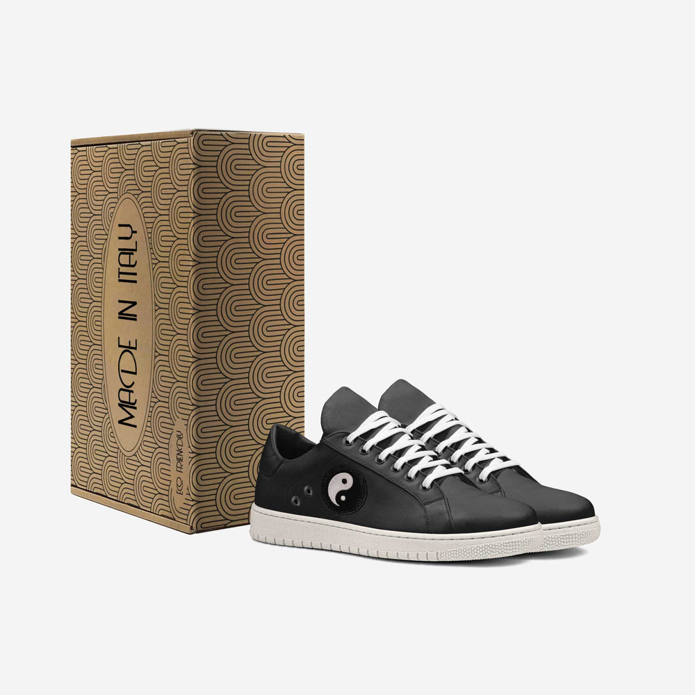 Vegan 'Gravity' sneakers in sleek low-top black, featuring a Yin-Yang patch on the side, blending eco-conscious materials with symbolic design.