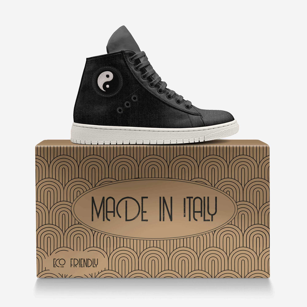 Vegan 'Nova' high-top sneakers in black denim fabric, featuring a circular yin and yang patch and black laces, designed for sustainable style and comfort. Featured with an eco-friendly box.