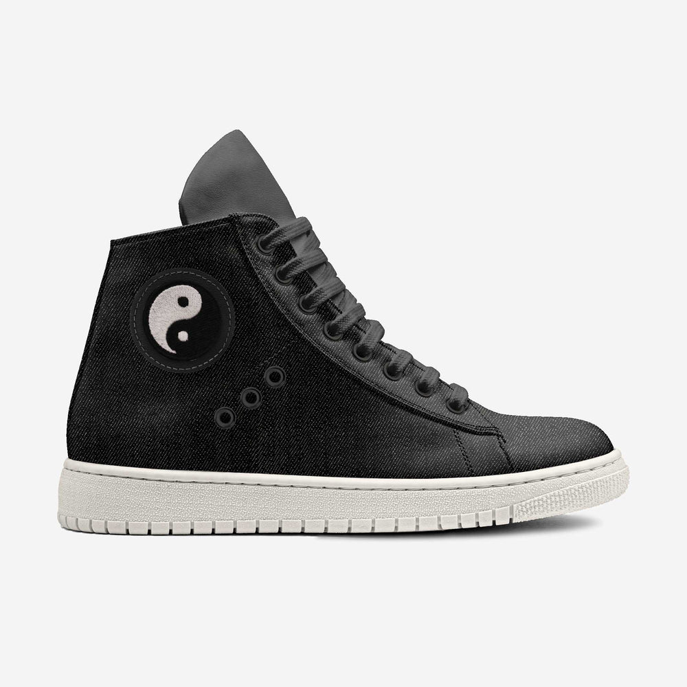 Vegan 'Nova' high-top sneakers in black denim fabric, featuring a circular yin and yang patch and black laces, designed for sustainable style and comfort.