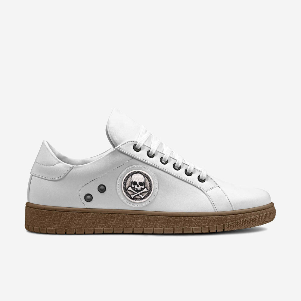 Eco-friendly 'Stride' sneakers with a classic white upper and striking skull patch, crafted from cruelty-free materials for an edgy, conscious look.
