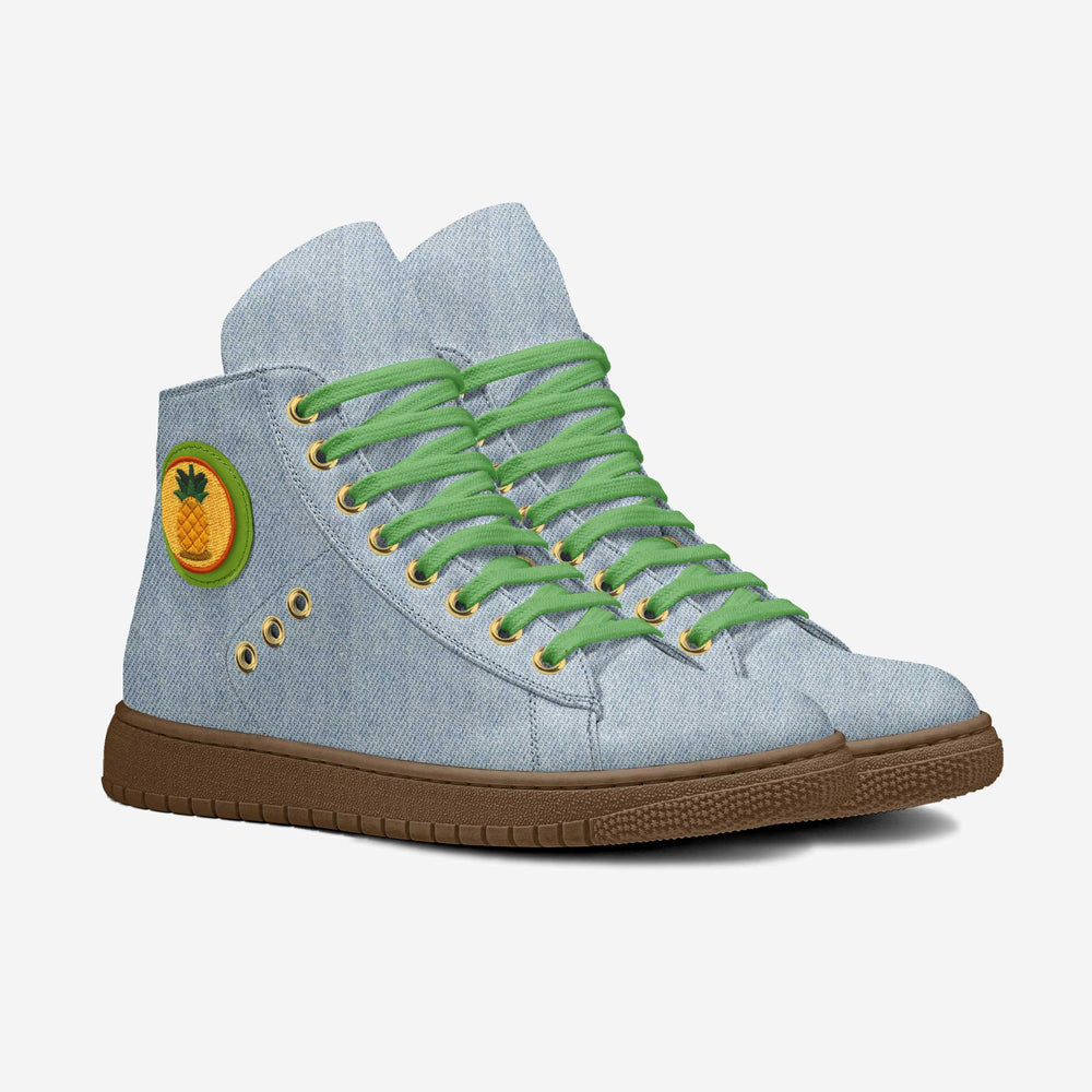 Sustainable 'Wave' high-top sneakers in denim fabric with a vibrant pineapple patch, featuring green laces and gold eyelets for eco-conscious style.